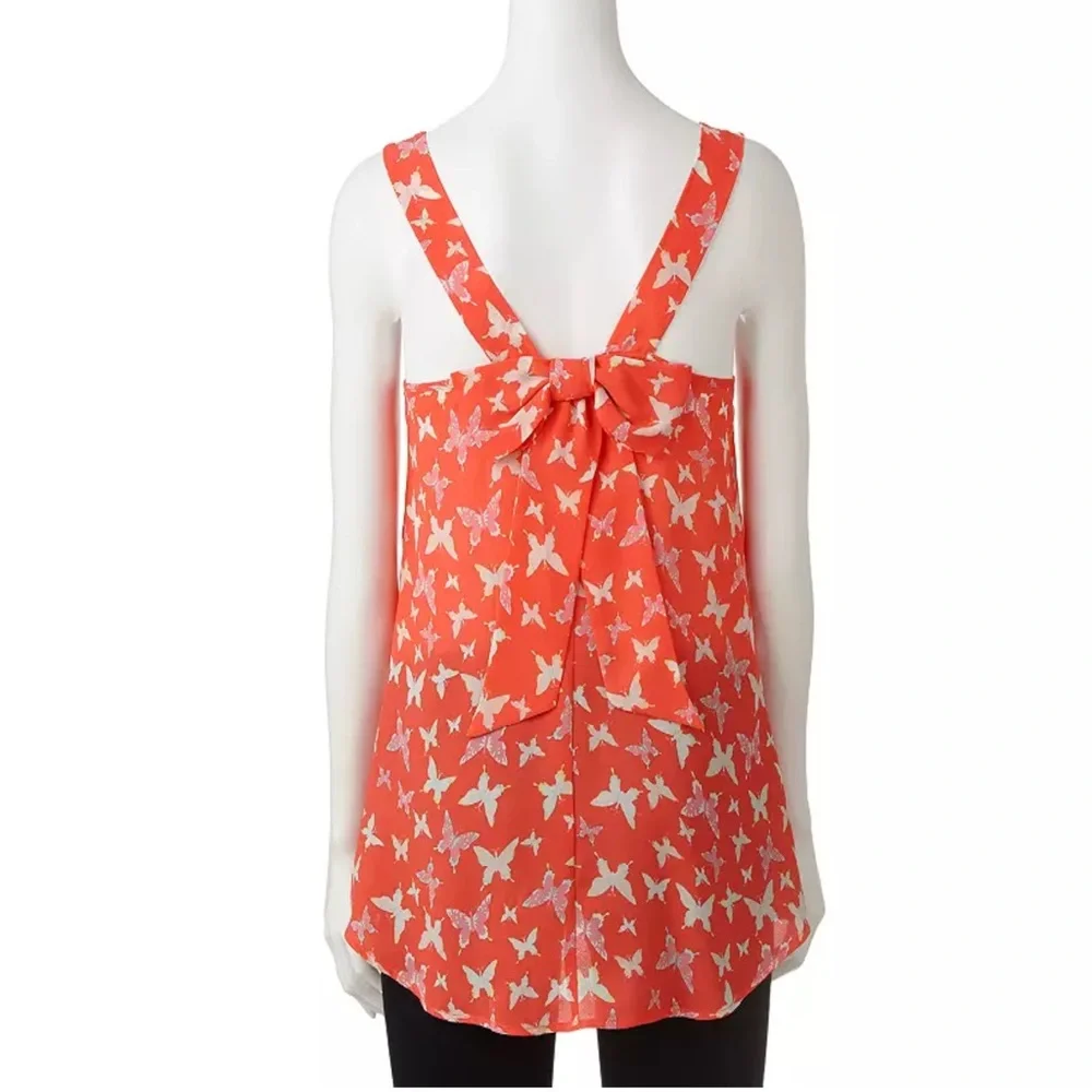 Candie’s Lovely Coral blouse with Butterflies and has a big Bow on back NWOT, XS